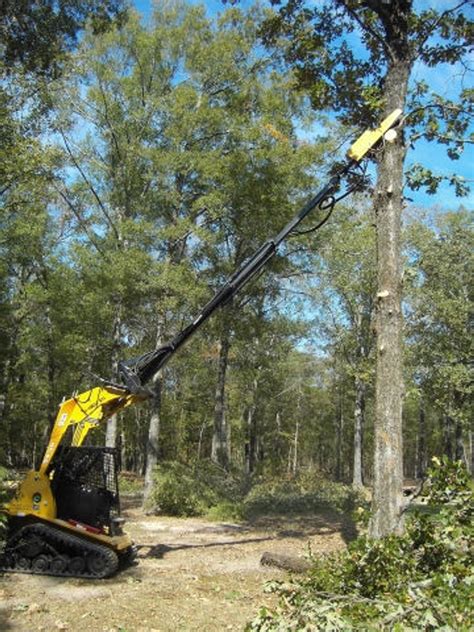 chainsaw skid steer|saw attachment for skid steer.